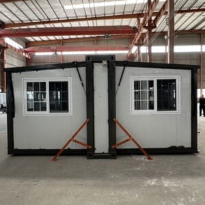 Black-framed 700mm mobile expandable house with hydraulic roof system and grid windows