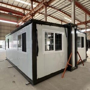 Black-framed 700mm mobile expandable house with hydraulic roof system and grid windows